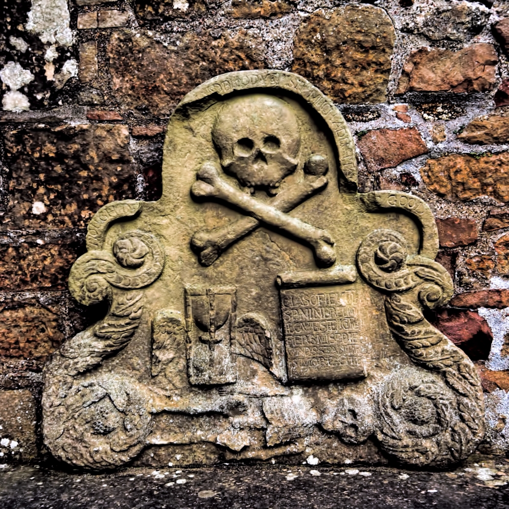 Scottish graveyard symbols on a medieval tombstone.