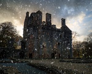 Snow falling at Huntly Castle on Christmas in Scotland.